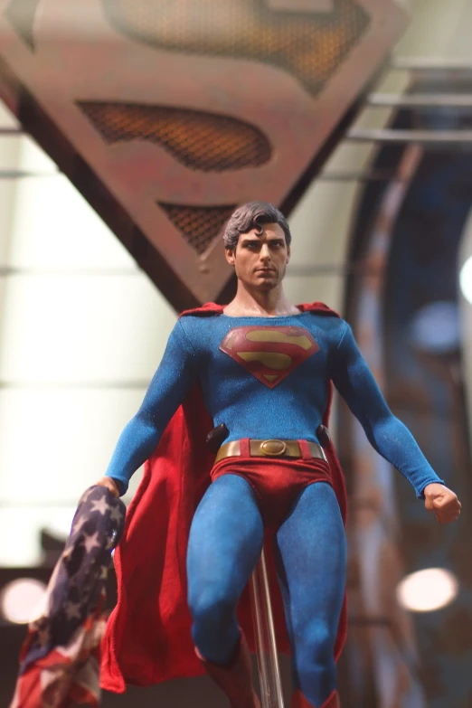 a model superman figure being displayed at a convention