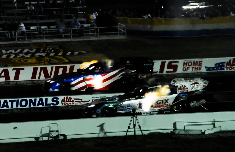 two cars on a track near each other