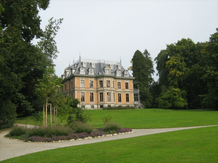 a large stone building with lots of windows