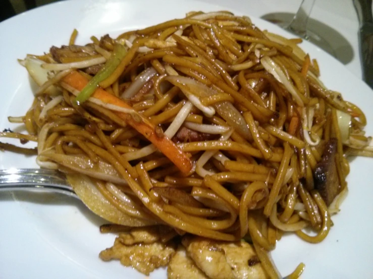 an oriental meal of noodles on a plate