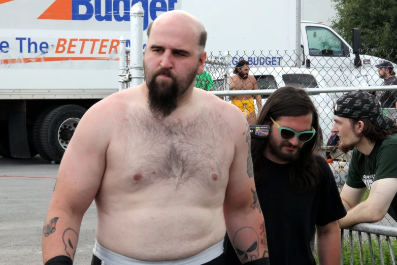 a man with a hairy beard and wearing sunglasses