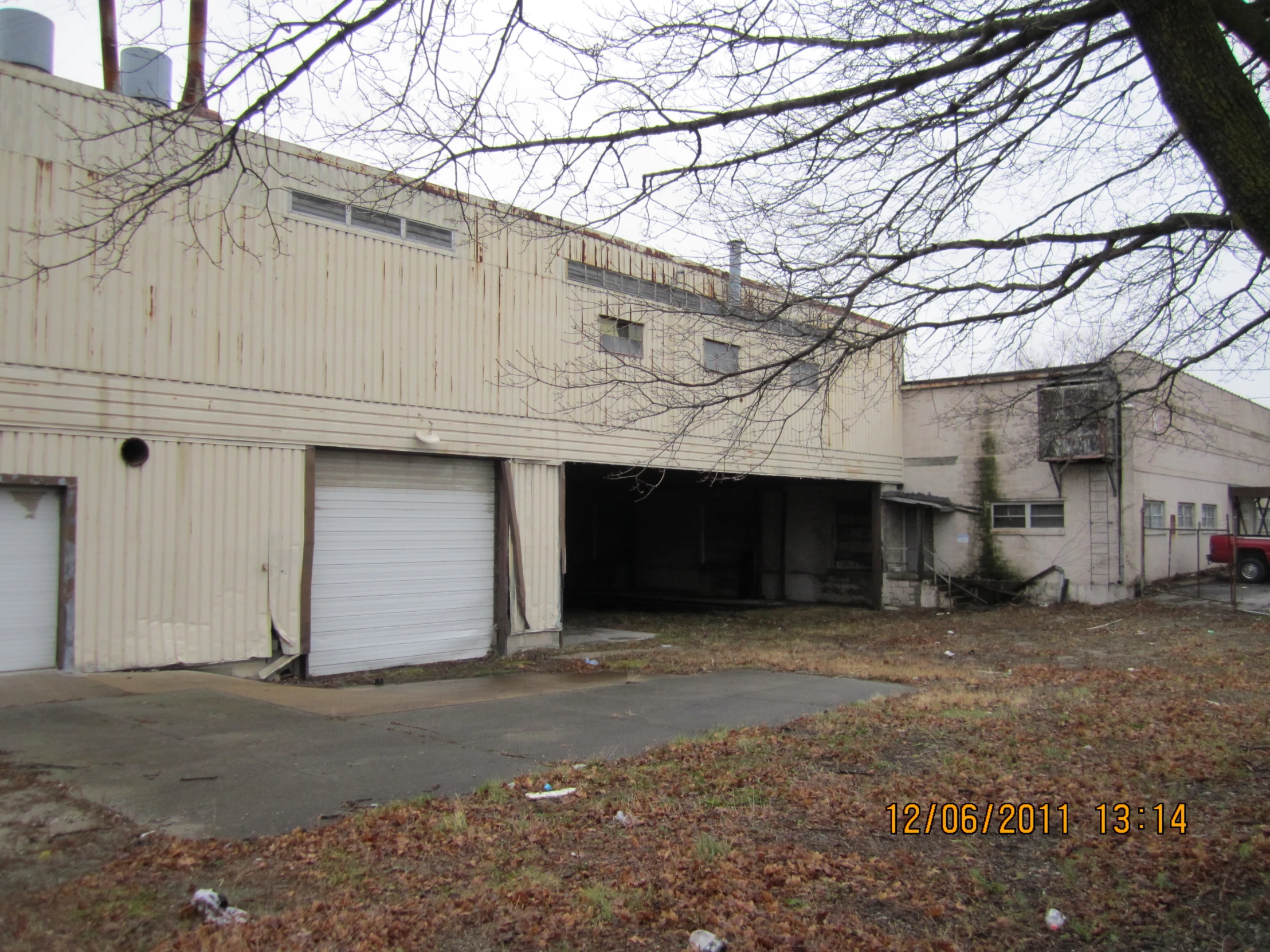 the outside of a building with two large garages