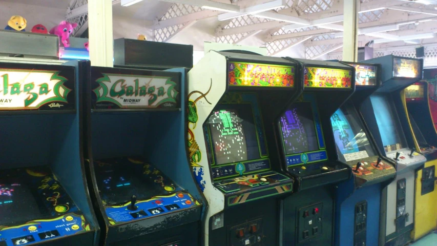 a row of old style arcade games lined up