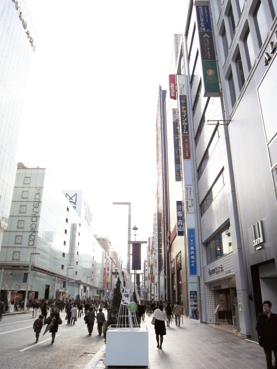 a group of people walking on a street