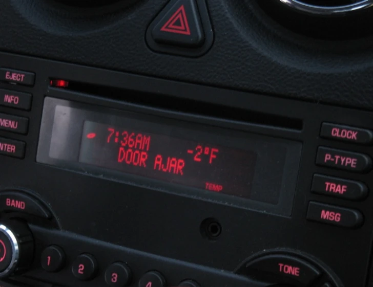an open car radio with a red led display