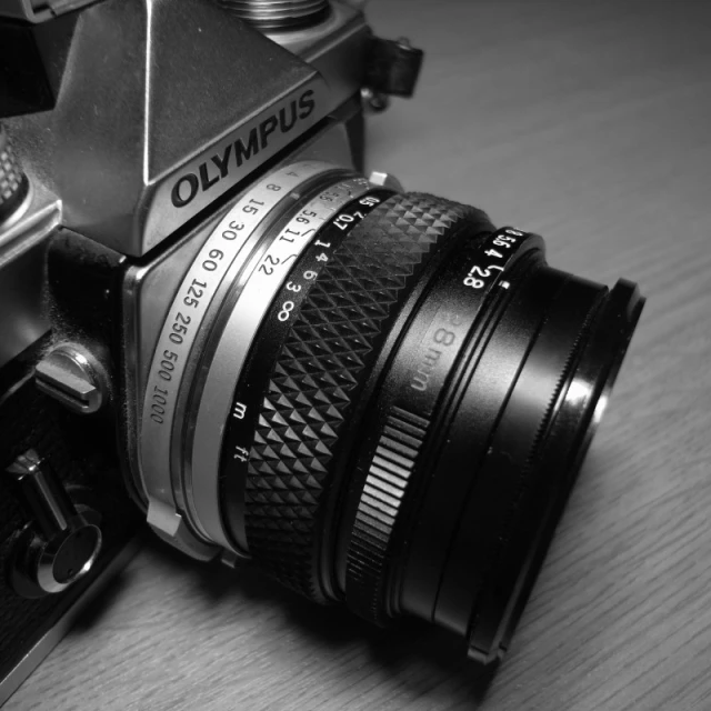 a camera that is on a table next to some books