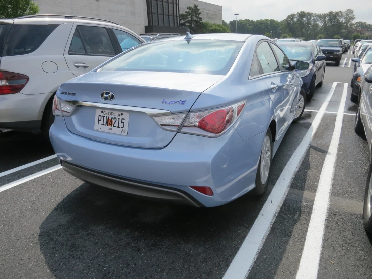 a row of cars parked in the parking space