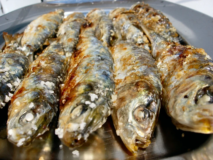 a plate of fried fish are ready to eat