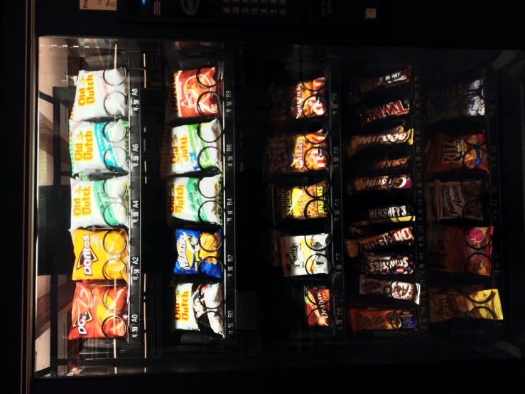 a vending machine filled with potato chips and chips