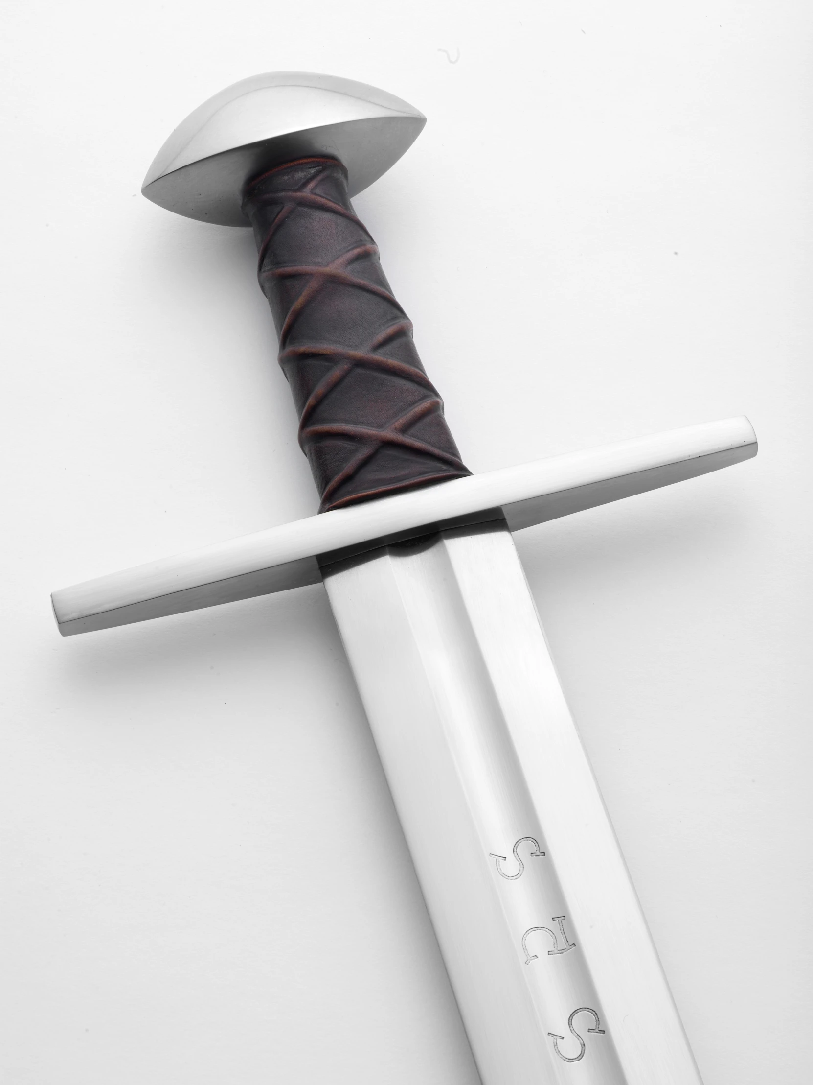 the dagger is made of leather and has a wooden handle