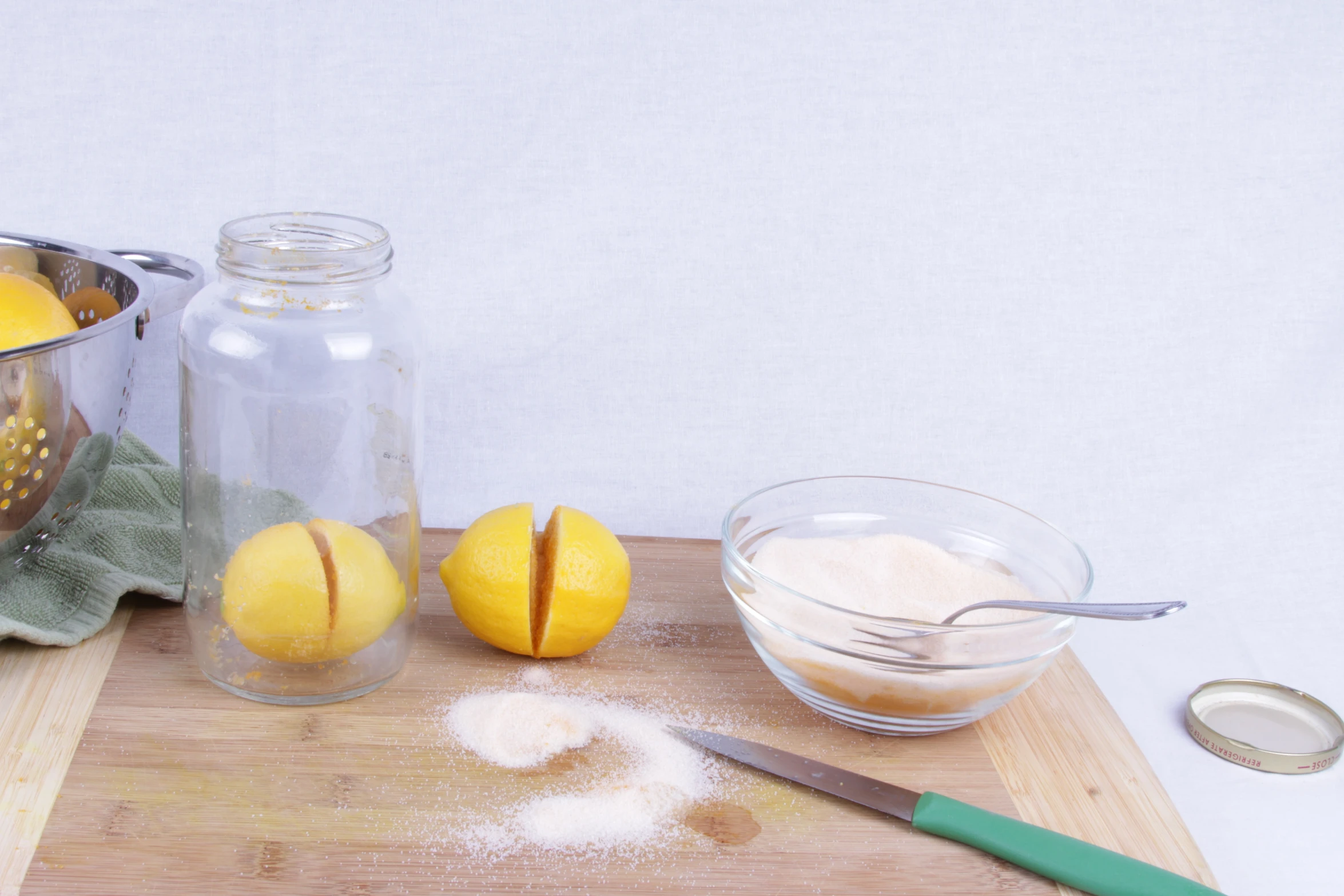 several oranges are being used to make a cake