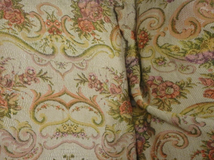 closeup view of a vintage fabric with flower designs