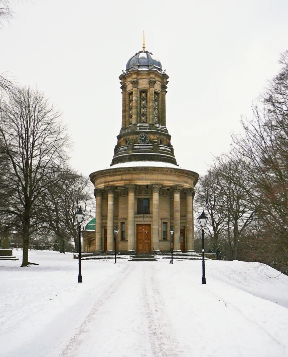 a building with a large spire covered in snow