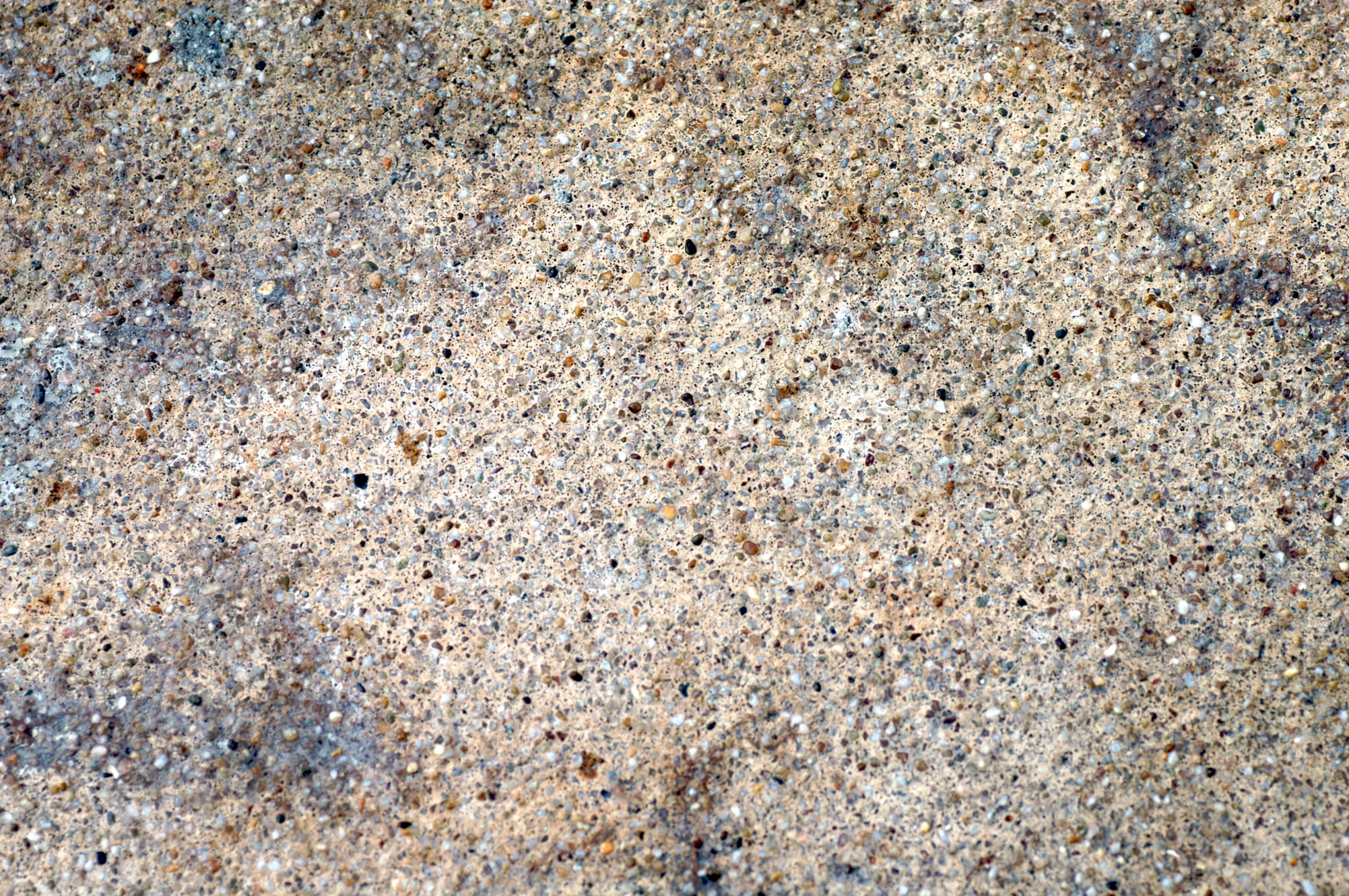 the texture of concrete is mostly gray and brown