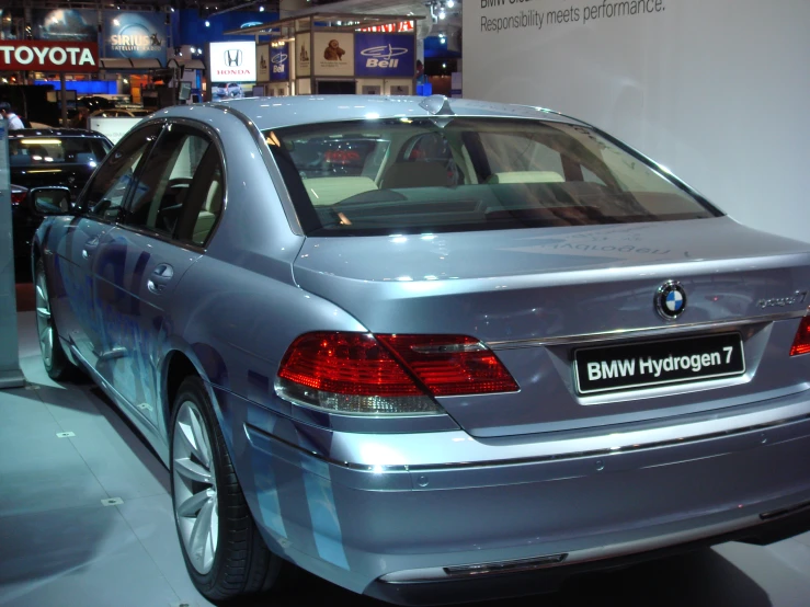 a silver bmw car on display at an event
