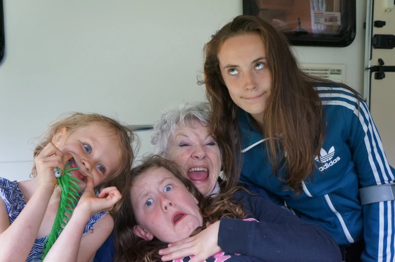 three women are posing for a po