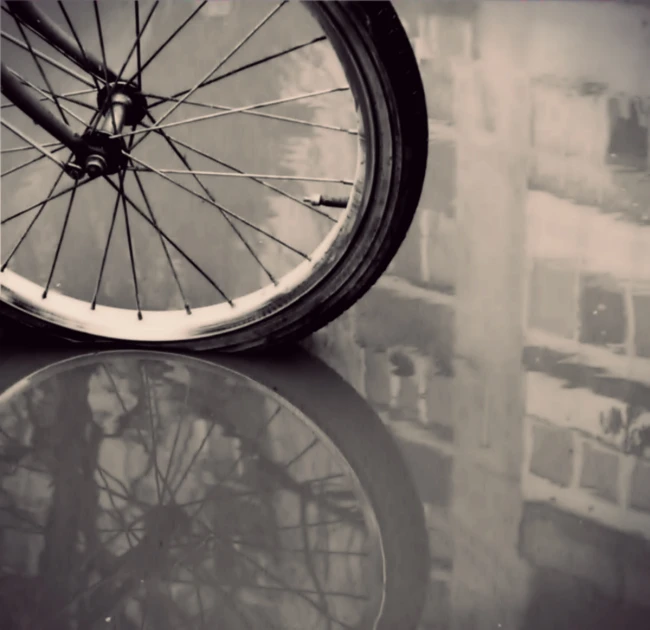 a close up view of a tire with the reflection on a table