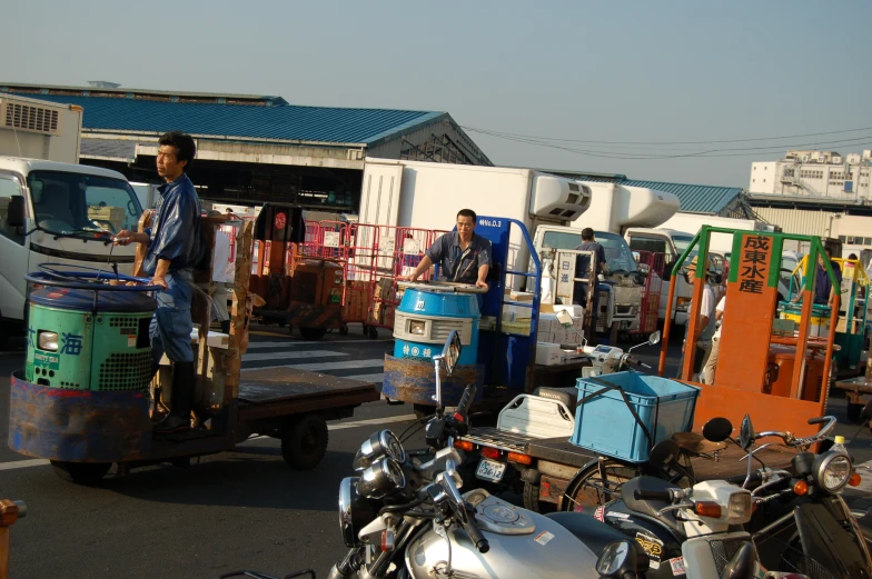 the man is riding his truck with large containers on it's back