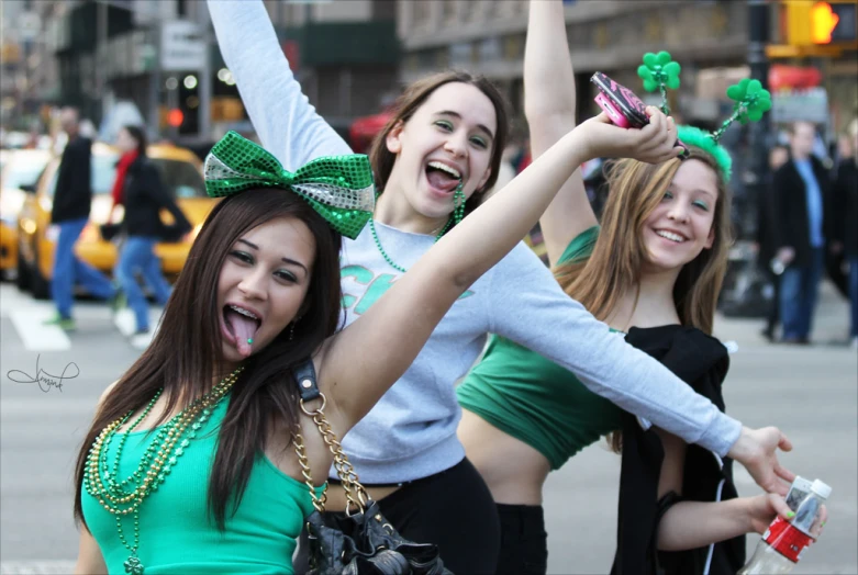 a group of women that are standing on the street