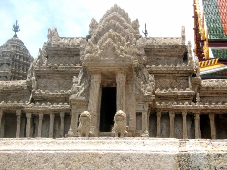 a temple with carvings and pillars on the outside