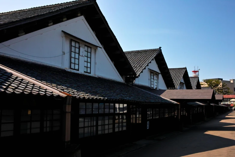 two rows of houses lined with different sized windows