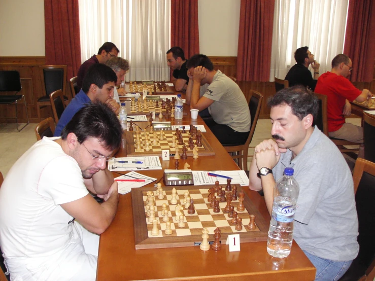 a chess game with two men playing the game