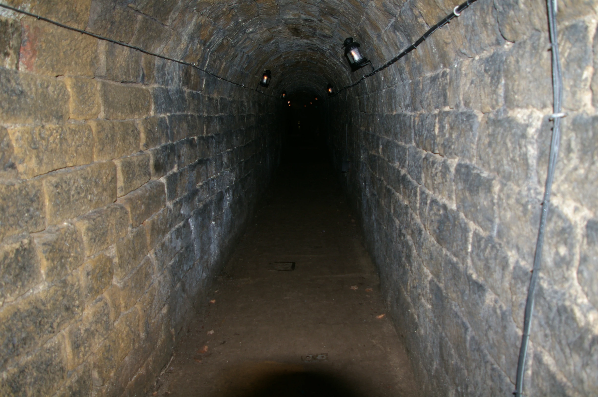 an image of a dark tunnel with light at the end