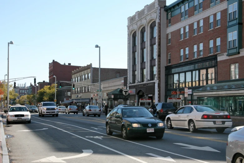 a car passing a traffic signal at an intersection