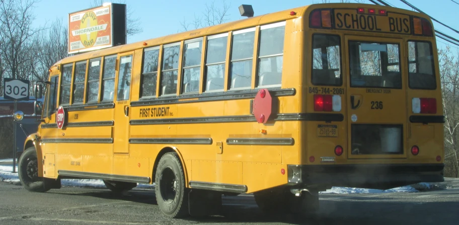 an image of the back of a yellow school bus