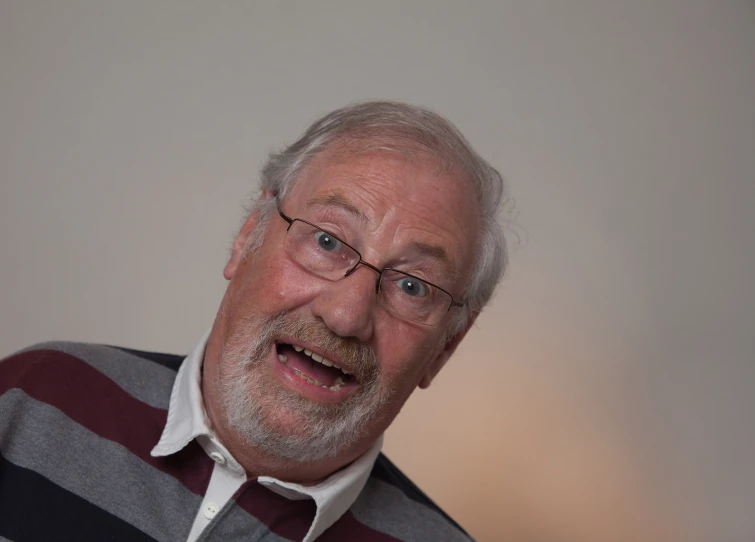 man with mustache and eye glasses making weird face