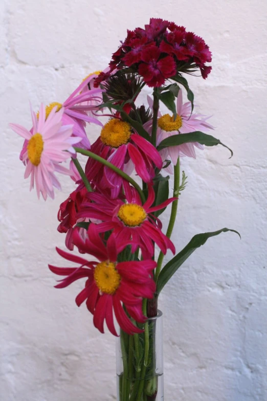 a vase with colorful flowers in it