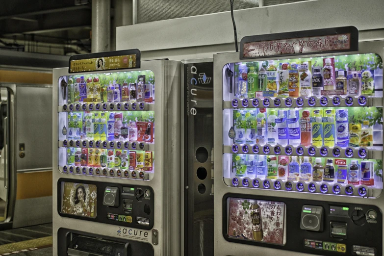 an airport ticket booth with vending machines displaying drinks