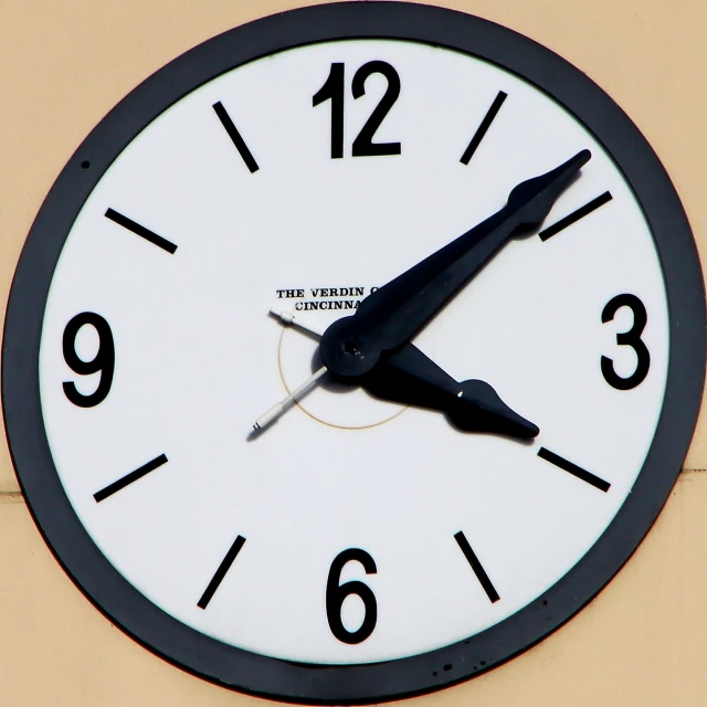 a black and white clock has words in it