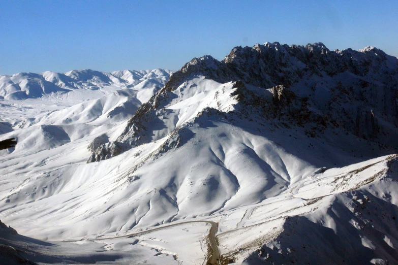 the top of snow covered mountains with no people