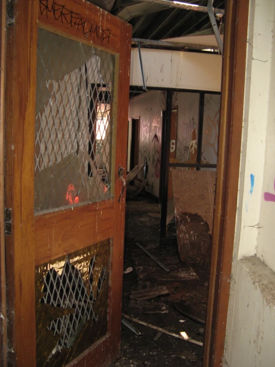 an old rundown hallway with rusty iron bars