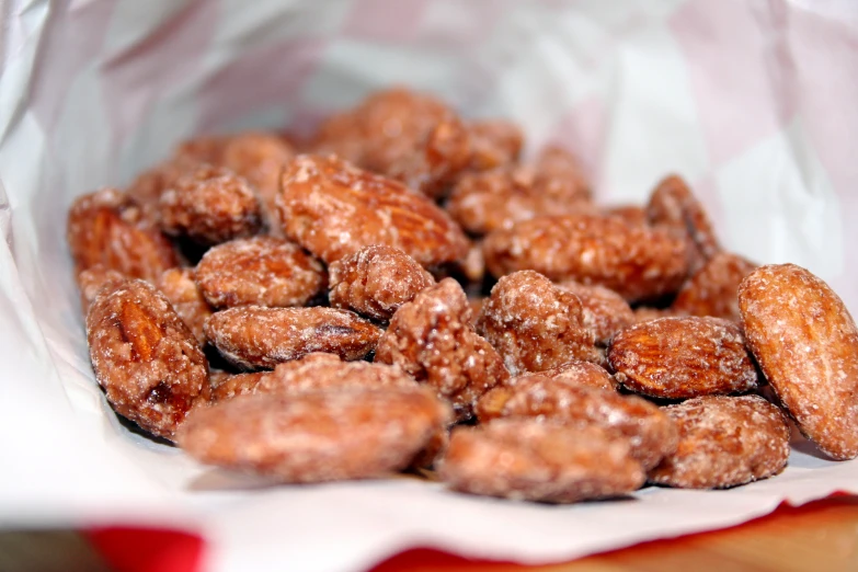 a pile of fried donuts sitting on top of a piece of paper