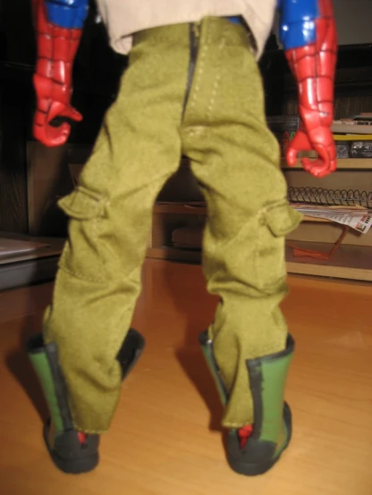 the legs of an action figure are in a pair of boots