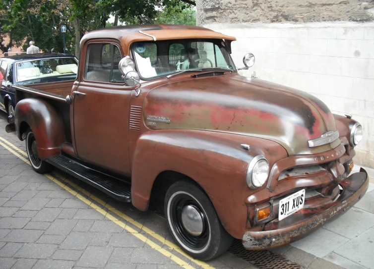 a brown truck parked on the side of the road