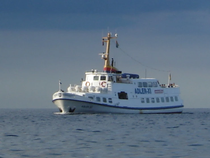 a large white ship in the open water