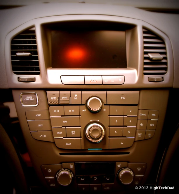 a vehicle with dashboard controls with a red light