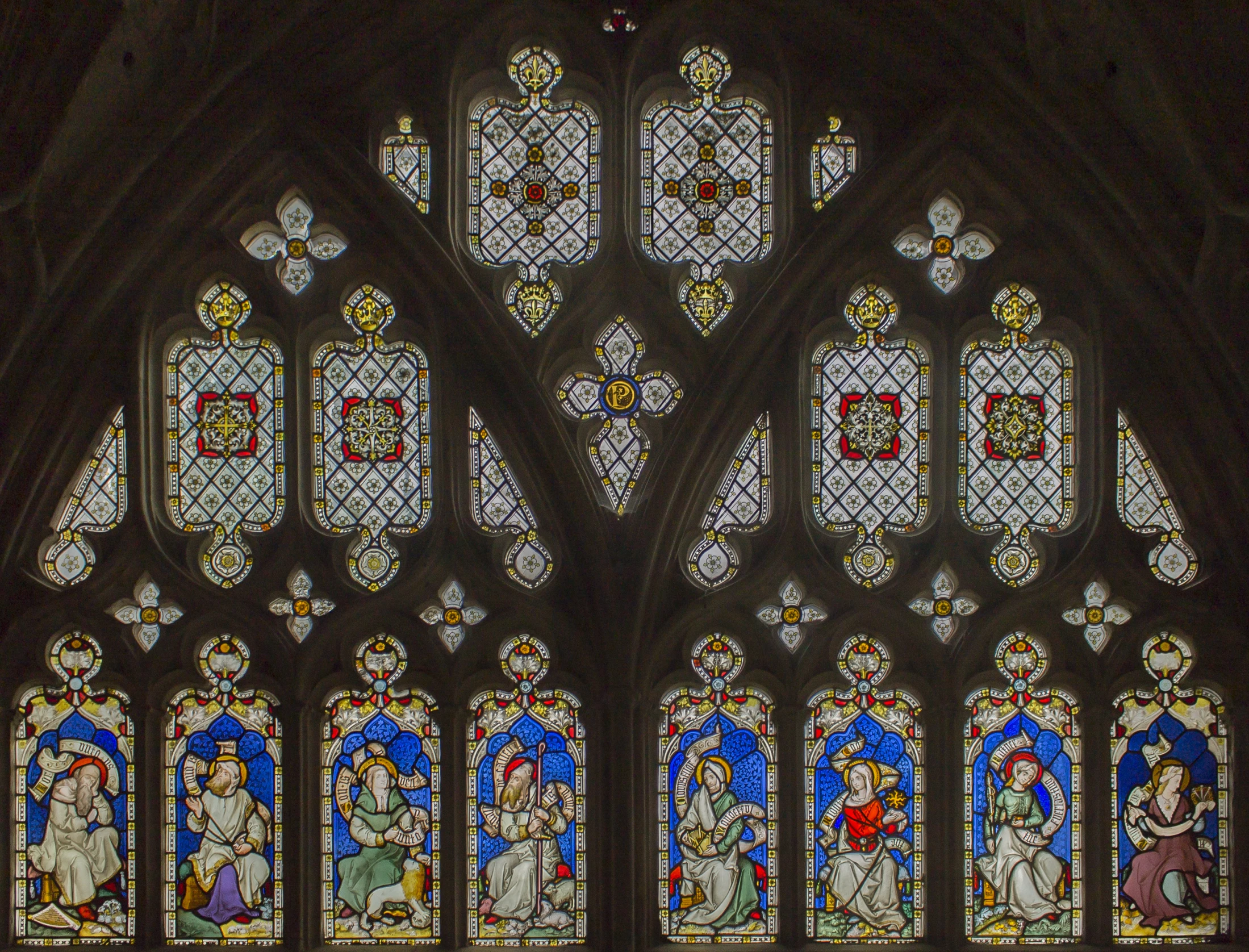 many stained glass windows in a building