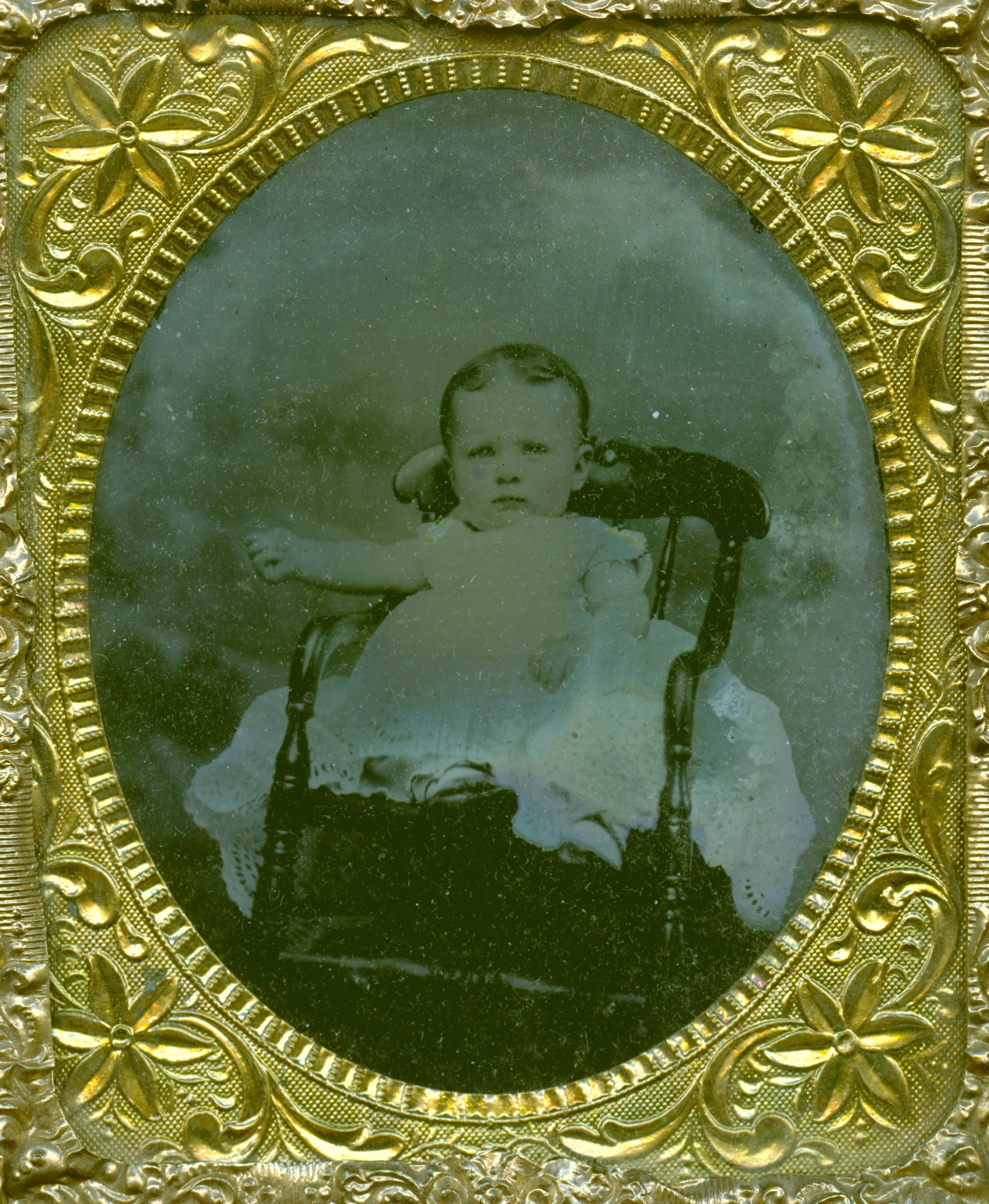 an old picture of a  in a gold frame