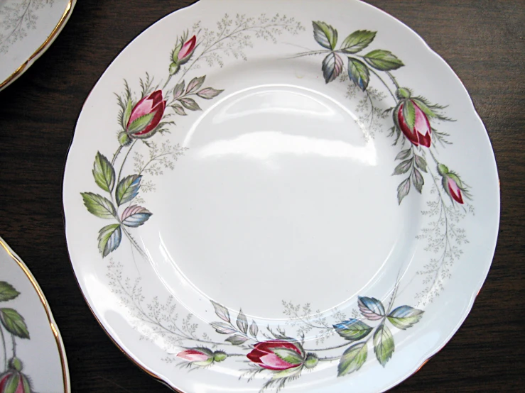 there is a very old china plate with flower design