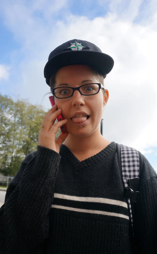 a woman is talking on her cellphone and wearing glasses