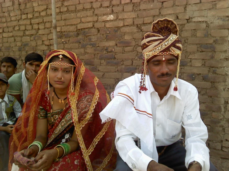 a man and woman sitting next to each other