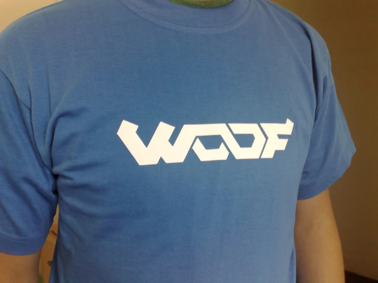 a man in a blue shirt has the word wauf on his back