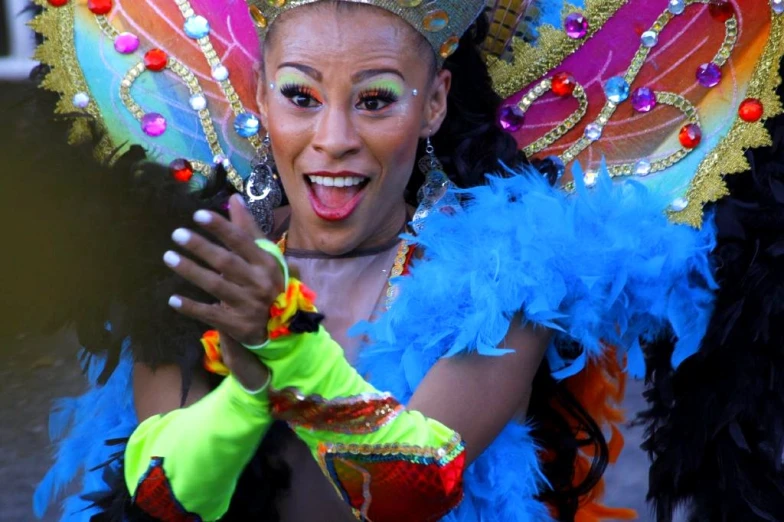 the woman in the colorful costume is holding a microphone