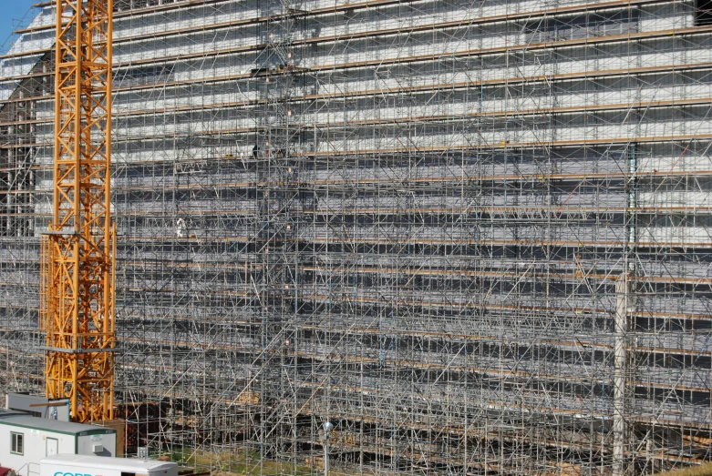 a building is shown covered in scaffolding on the side