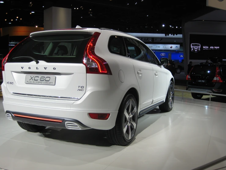 a white suv sitting on top of a floor