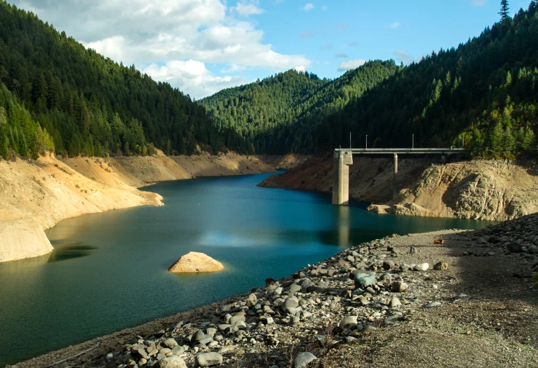 the view of a bridge over a large river